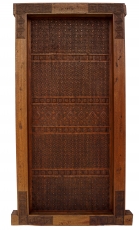 ornately carved teak door